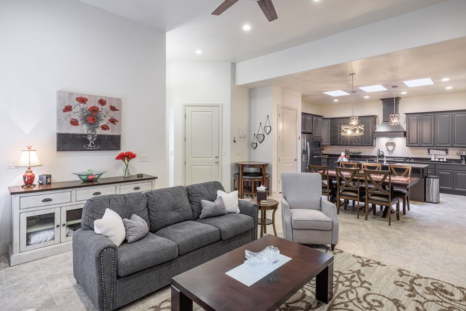 Living Room View - The Living Room is located adjacent to the dining room and is the perfect place to relax and watch your favorite movie or TV program.
