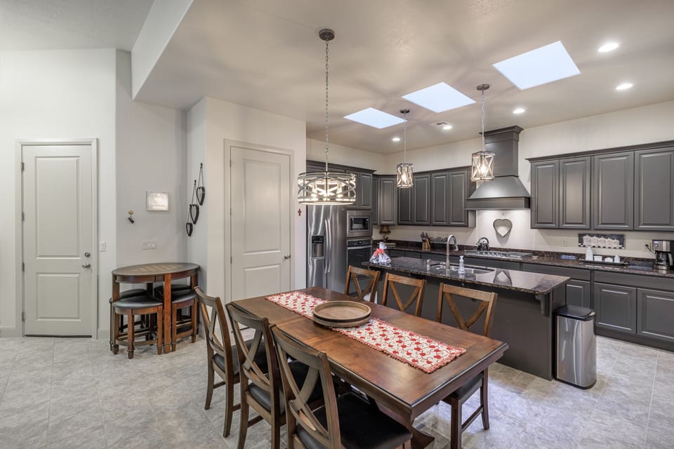 Dining Table and Kitchen - The beautiful wood dining room set can comfortably seat 8 people.