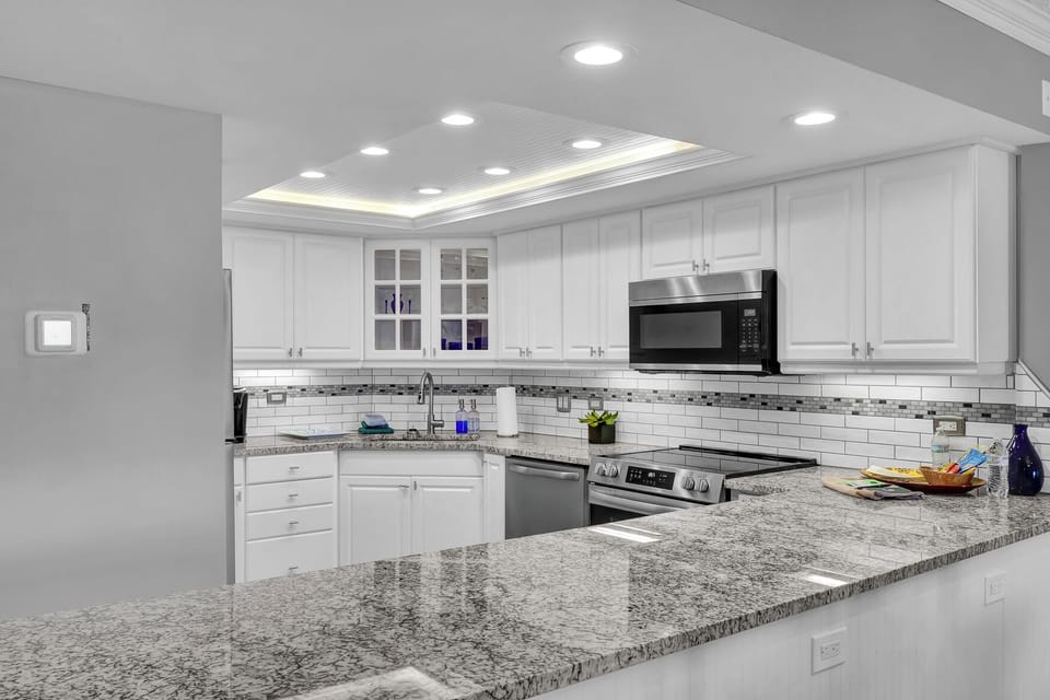 Kitchen - Newly renovated with updated appliances and stone counters