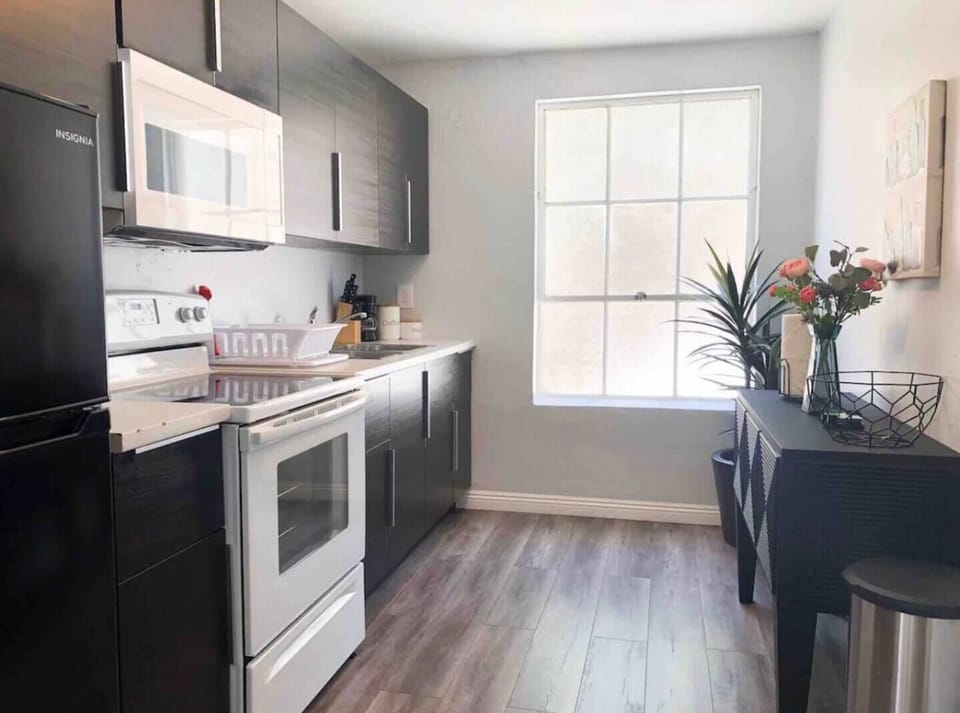 Full Kitchen includes all pots, pans, silverware, coffee maker, coffee, sugar, creamer, tea, blender, toaster, refrigerator, microwave, glasses, wine glasses and cooking/eating utensils