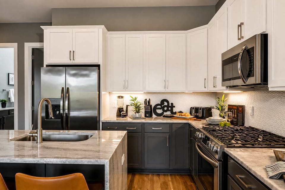 Chef-ready kitchen with stainless steel appliances and complete cookware set.