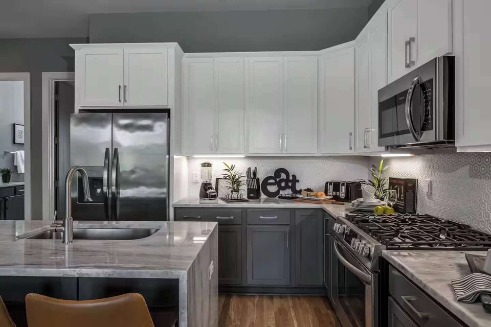 Stunning kitchen featuring stainless steel appliances and full cookware