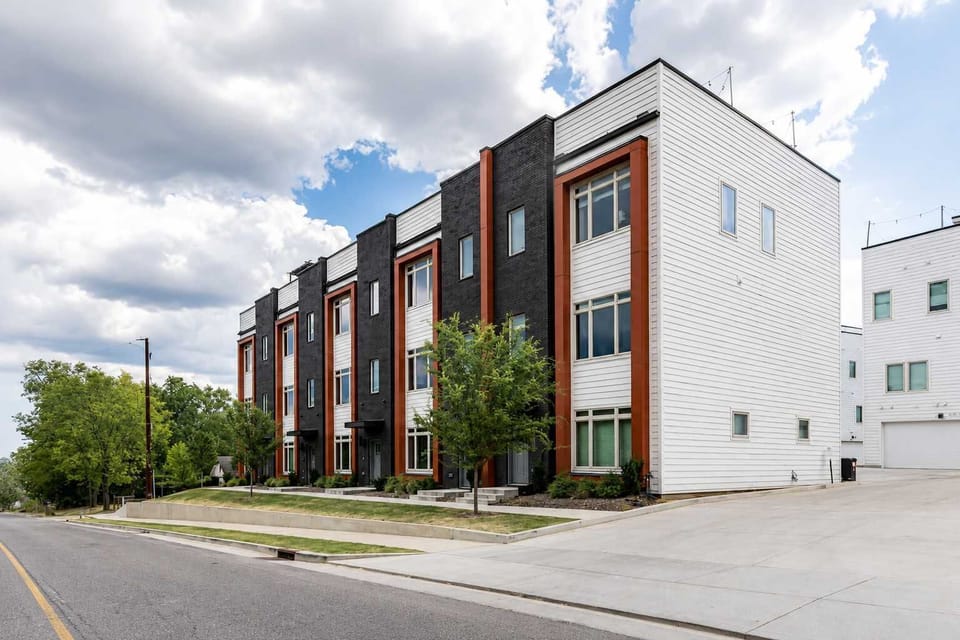 Multi-story townhome architecture features a contemporary design