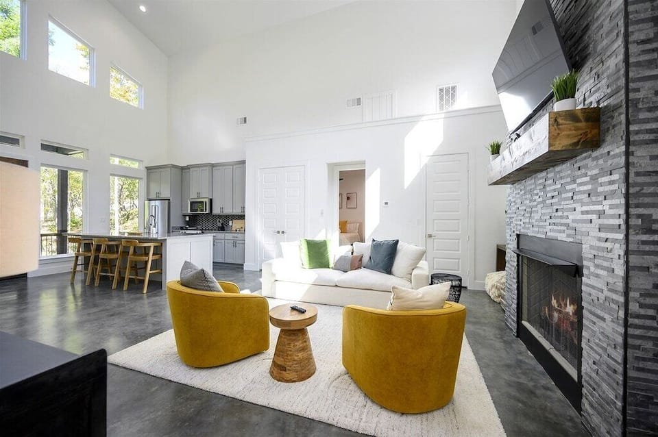 Living Room: Bright and airy space with sleek décor, perfect for gatherings by the fireplace!