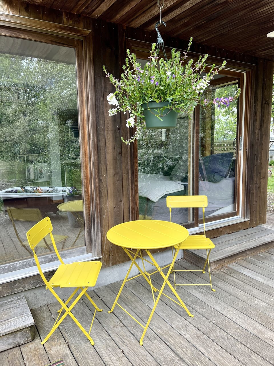 Private deck with table and chairs and grill. Access to hot tub. 