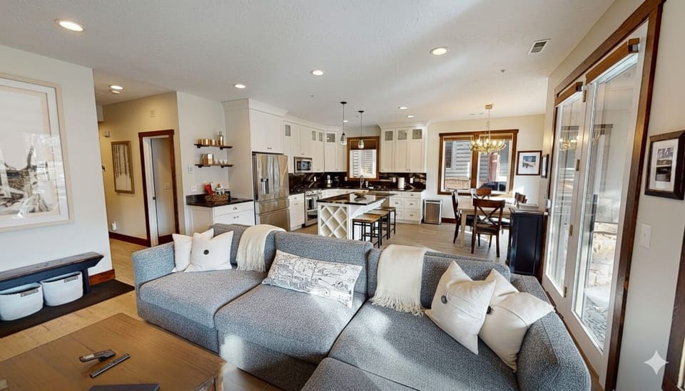 Sink into this plush sectional and enjoy your open-concept retreat where kitchen, dining, and living spaces blend seamlessly for perfect relaxation.