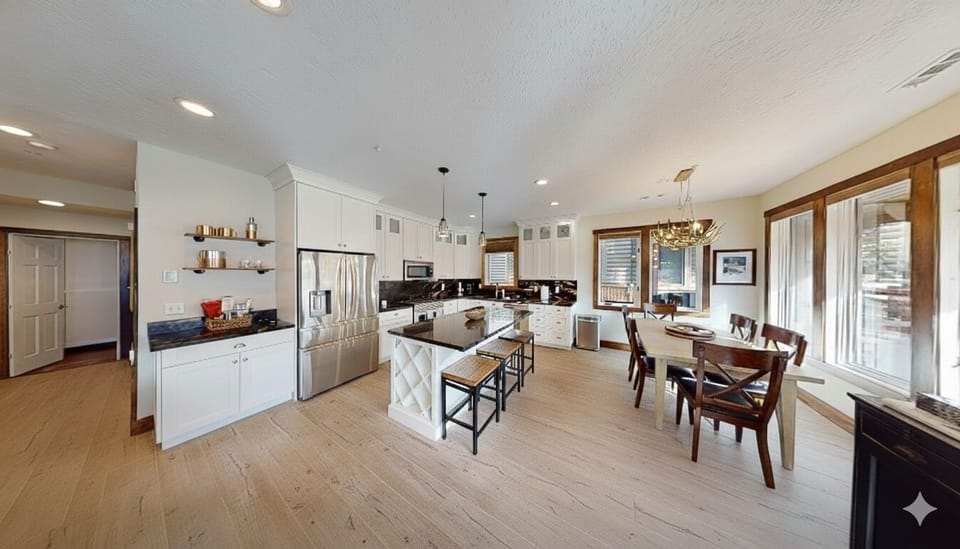 Your spacious open-concept kitchen flows seamlessly into the dining area, featuring modern appliances and a cozy breakfast island for memorable meals.