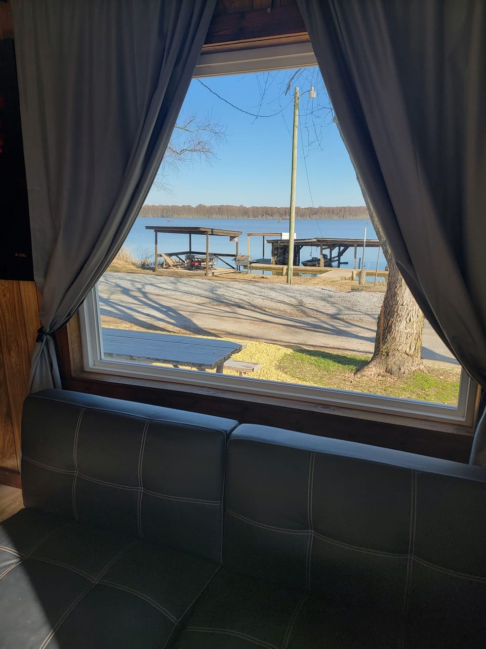Huge picture window gives you a view of the lake and the sunrise 