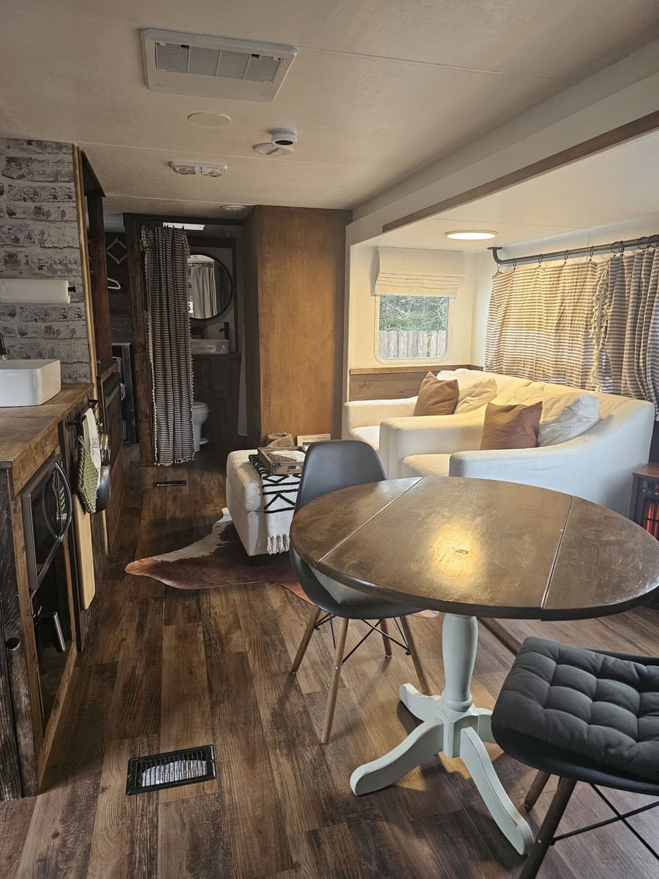 Main Living Space hosts the Kichen, Dining Space, and Two Wonderful Chairs