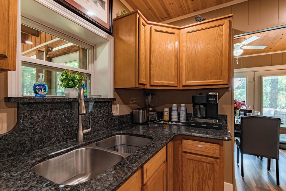 Granite countertops, a roomy sink, and plenty of prep space make cooking and cleanup simple during family stays.