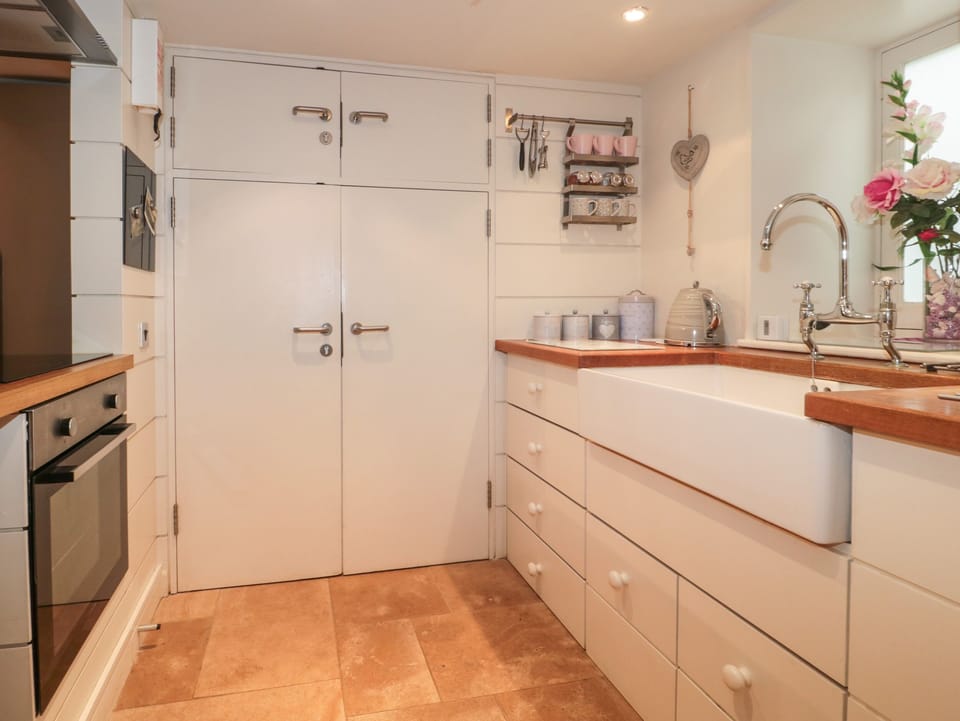 Fridge, electric kettle, toaster, cookware/dishes/utensils