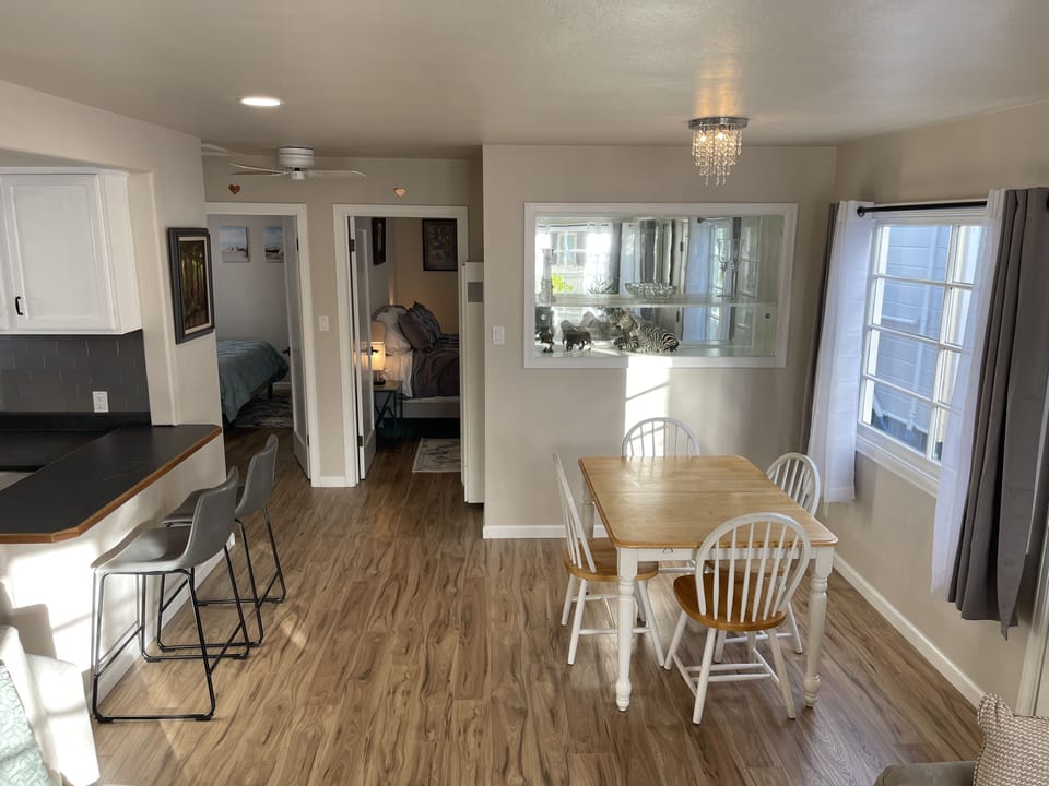 Spacious dining area with big table. also doubles as a great workstation.