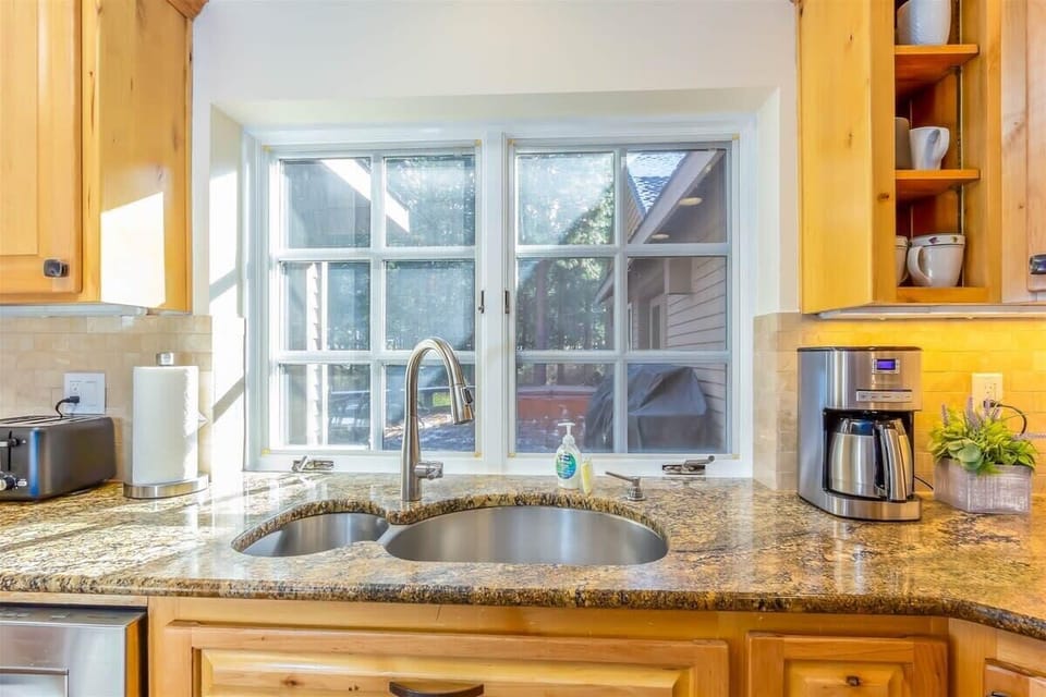 Kitchen window provides views of the back deck