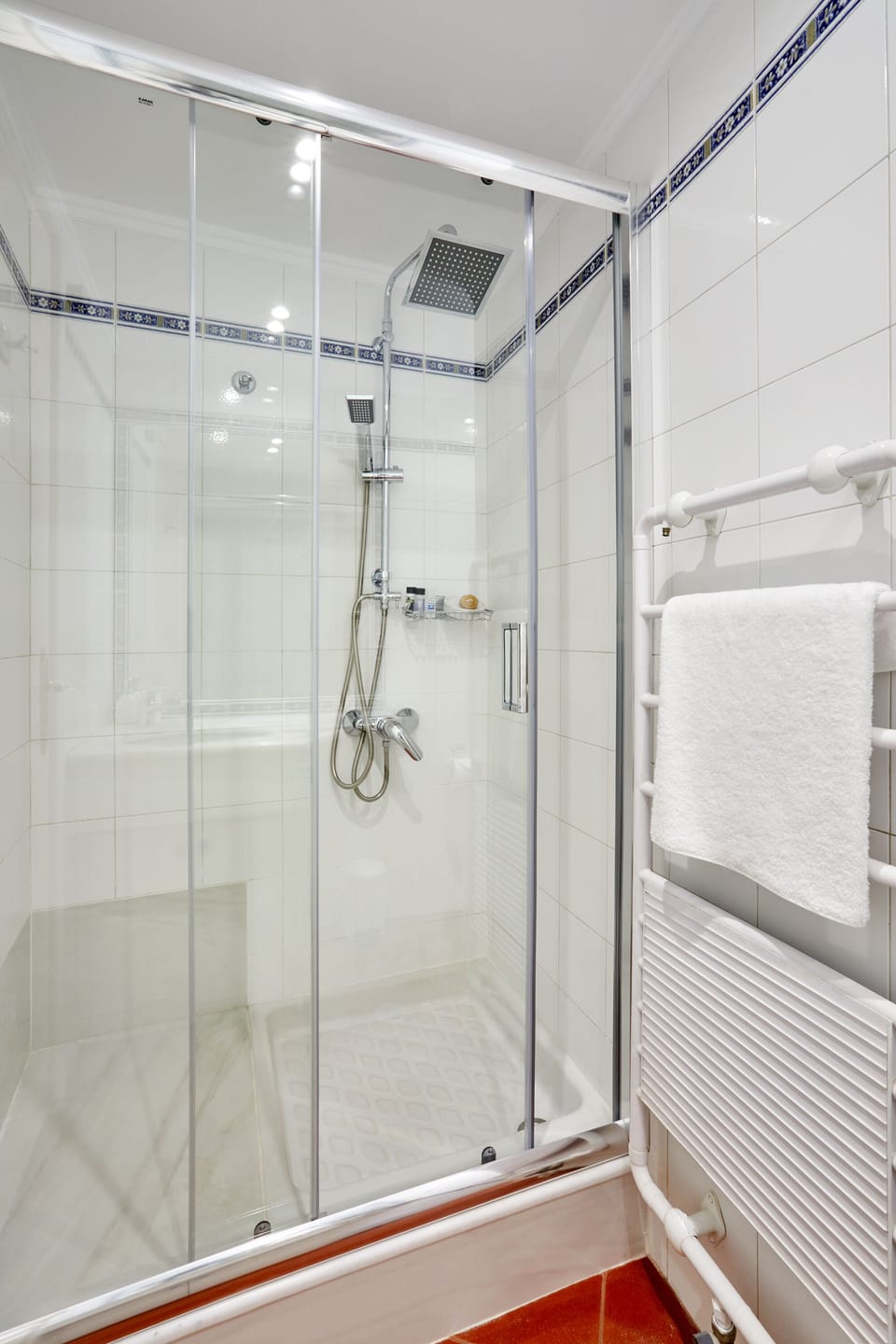 The bathroom features a shower.