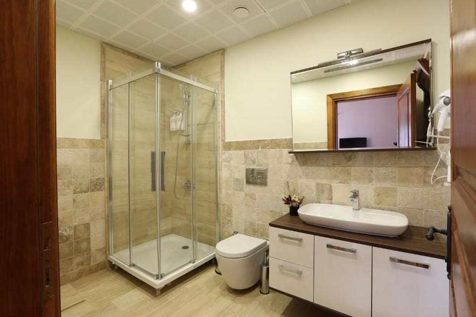 Shower, rainfall showerhead, hair dryer, towels