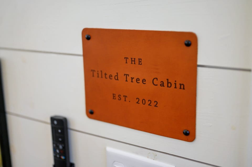 Welcome to: The Tilted Tree Cabin! Enjoy a charming escape in nature, established in 2022!