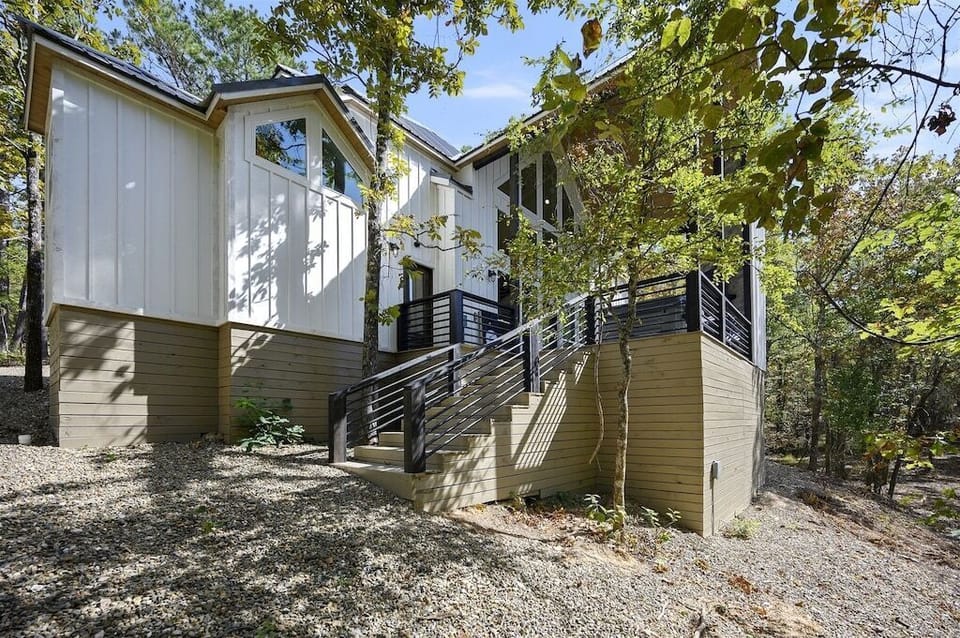 Exterior: Embrace nature in this modern retreat with stunning forest views and sleek architecture!