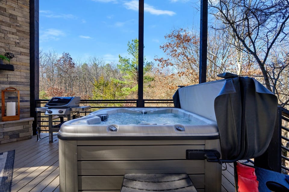 Spa Retreat: Relax in the hot tub with scenic views of nature all around! Perfect for unwinding.