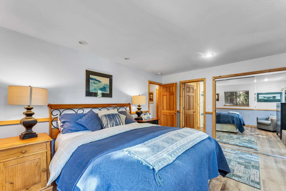 Bedroom 1: Master bedroom, king bed, reading chair, closet, dresser, TV, en-suite bath, access to lower deck and hot tub, lower floor 
