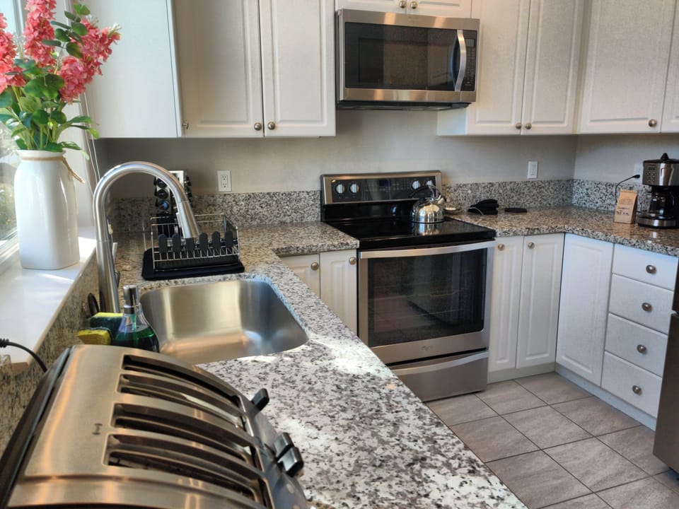 Full kitchen with dishwasher and French door refrigerator