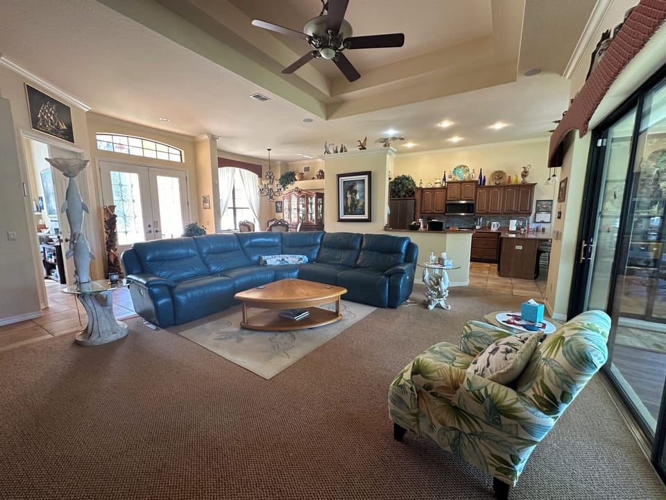 looking through the living room to the kitchen.  The sofa is electric reclining.