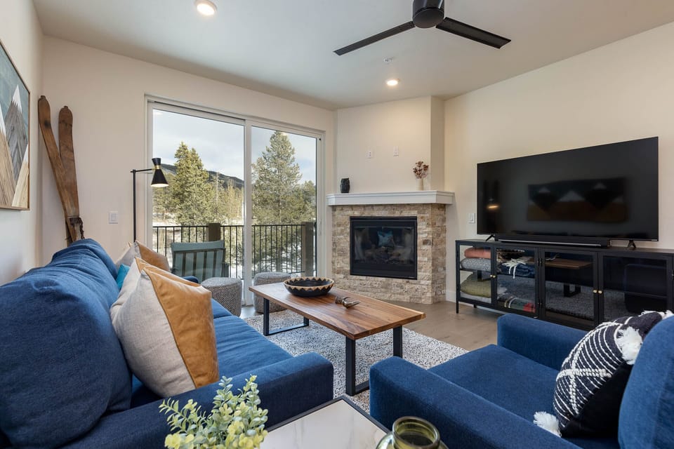 Great room with stone fireplace facade 