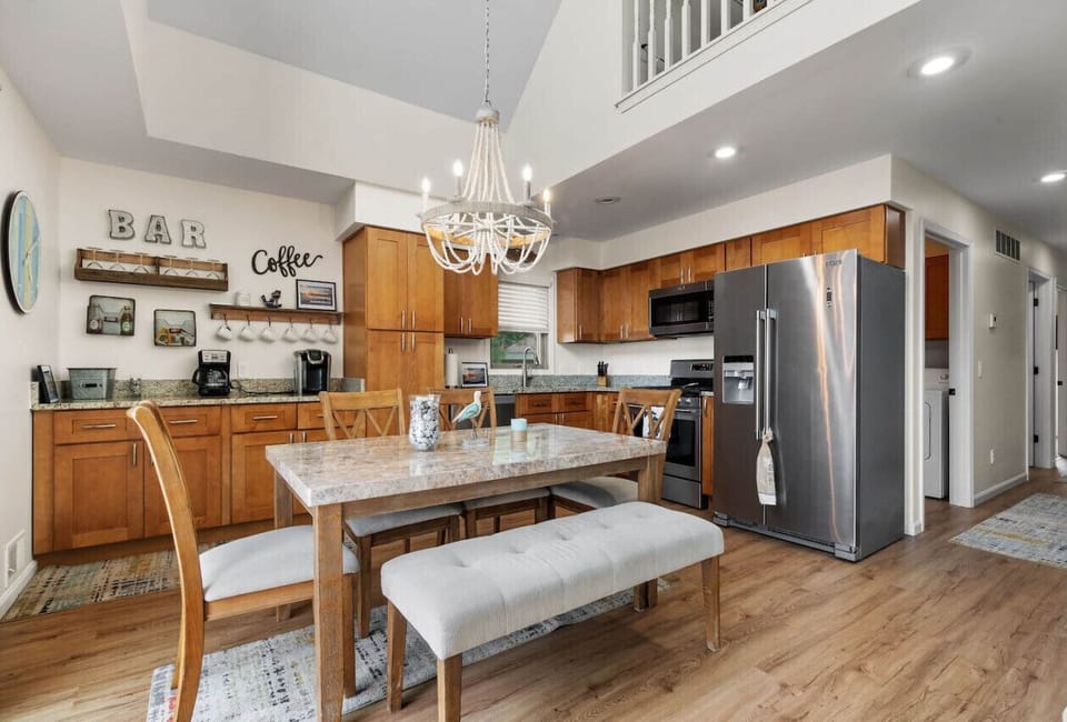 Dining area and kitchen with stainless steal appliances