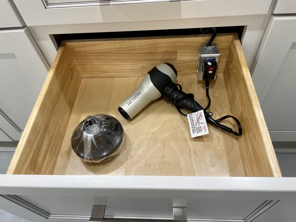 Great convenience! An electrical outlet with hairdryer in both bathrooms.