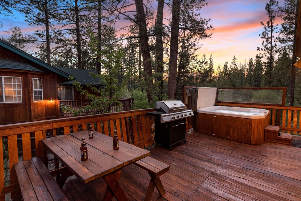 Our newly remodeled spacious outdoor deck has a barbecue, spa and picnic table.