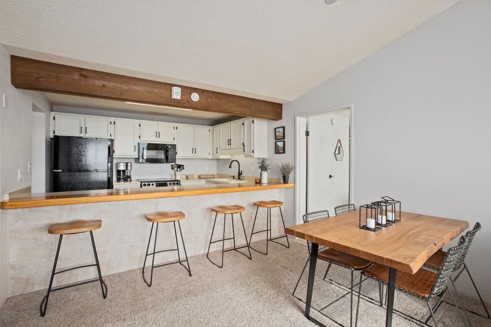 Dining Area, Access to Bedroom 2, Kitchen Pass Through and  Bar Seating