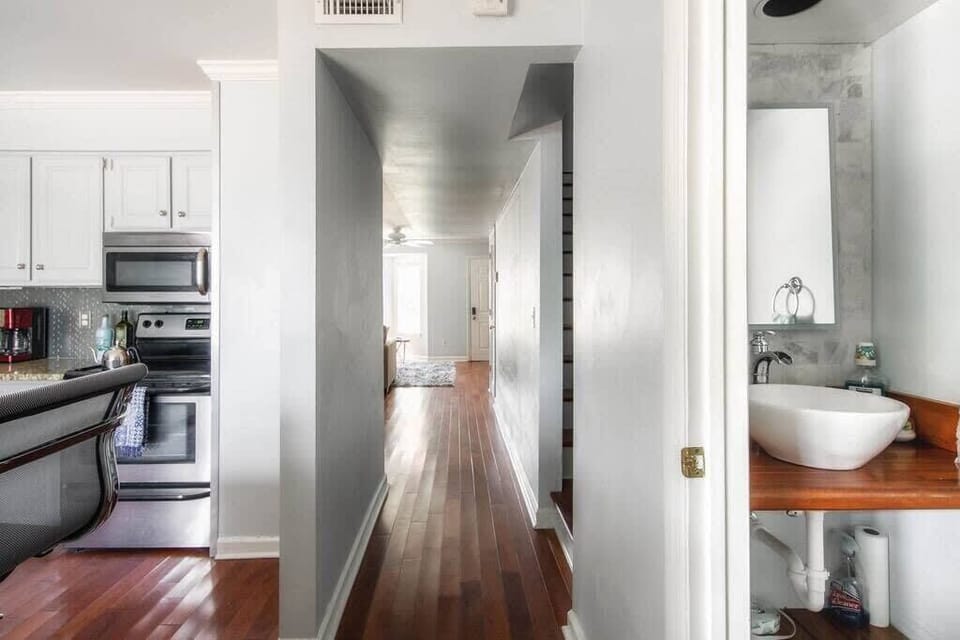 Hallway between Kitchen and Living Area + Half Bathroom