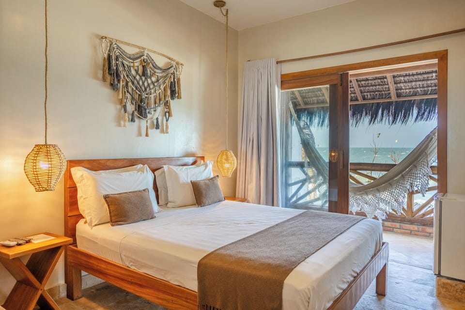 Sea Front Superior Suite | Minibar, in-room safe, iron/ironing board, free cribs/infant beds