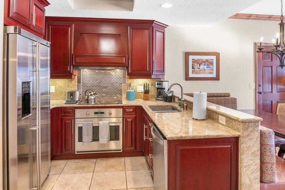 The well-laid-out kitchen makes efficient use of the space providing ample cabinet and counter space and is fully equipped with everything needed to put together a delicious meal.