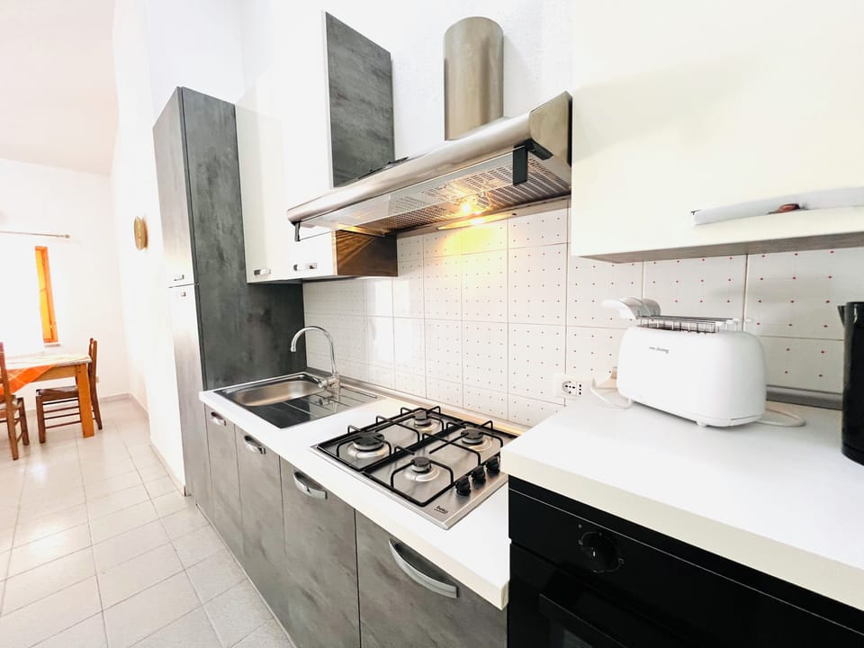 Apartment | Private kitchen | Full-size fridge, oven, stovetop, cookware/dishes/utensils