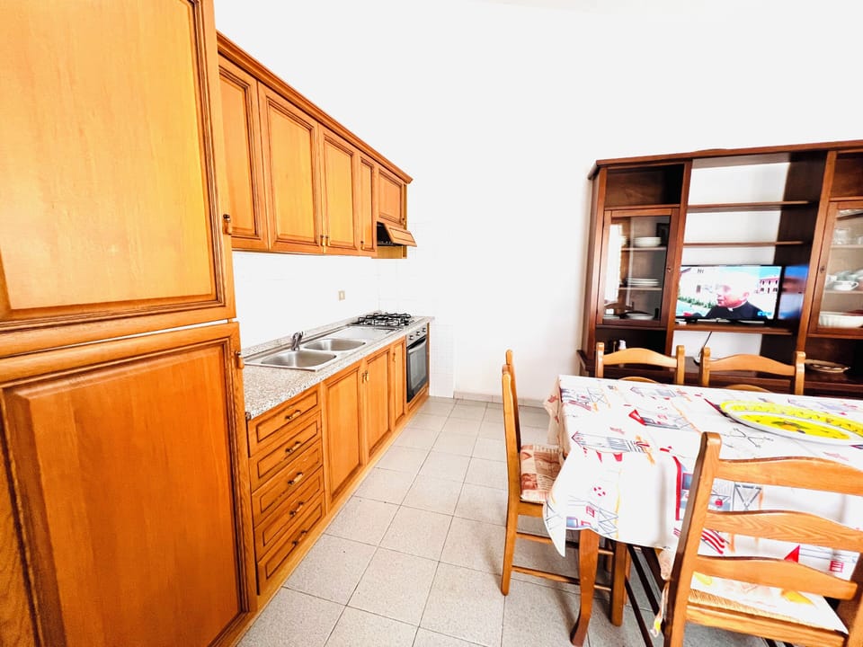 Apartment | Private kitchen | Full-size fridge, oven, stovetop, cookware/dishes/utensils