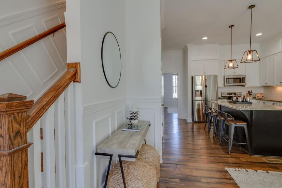 A staircase landing with a guitar display gives a nod to Nashville`s musical roots.