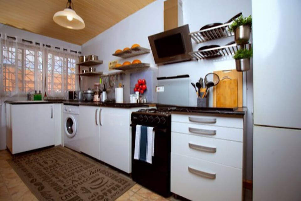 Open kitchen with washing machine.
