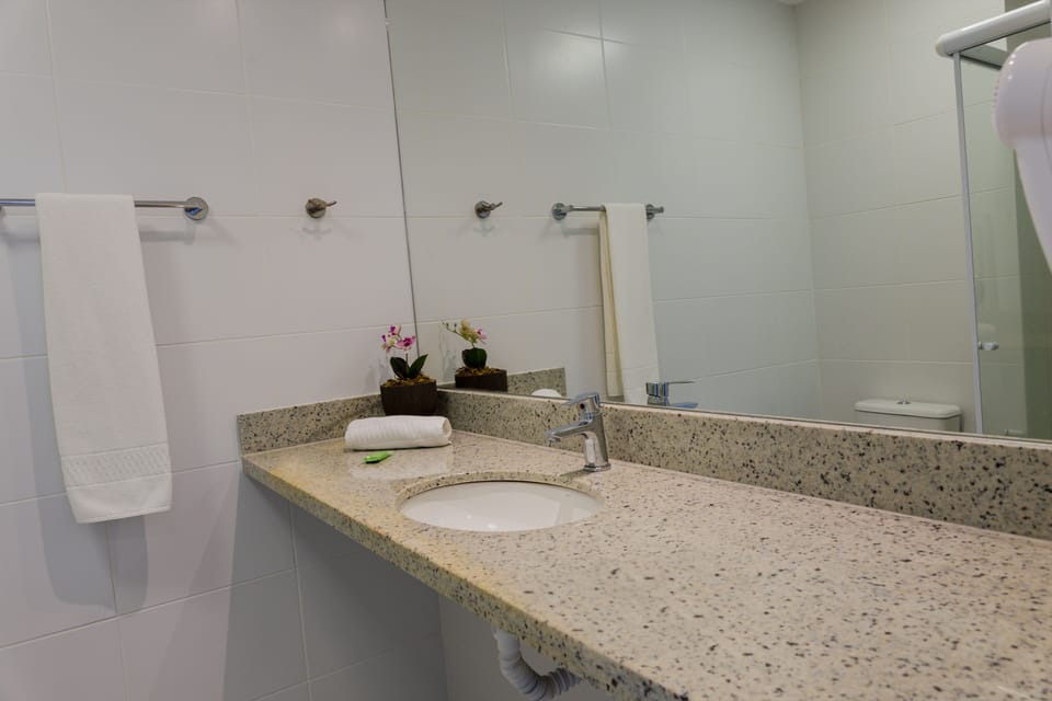 Shower, rainfall showerhead, hair dryer, towels