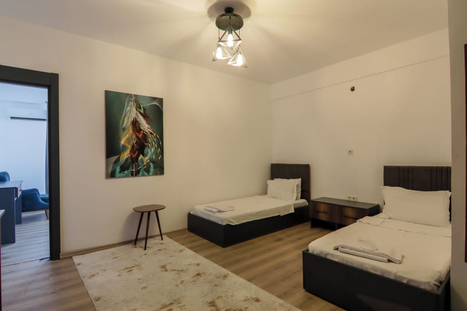 Family Room | Minibar, in-room safe, laptop workspace, blackout drapes