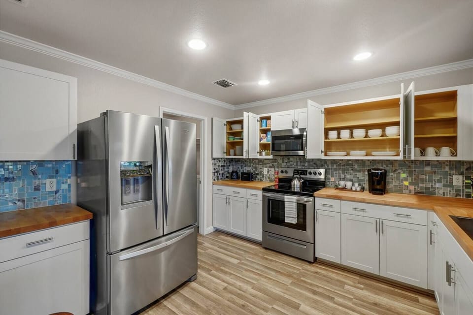 Stainless steel appliances and a fully stocked kitchen will be helpful as you create meals and memories together.