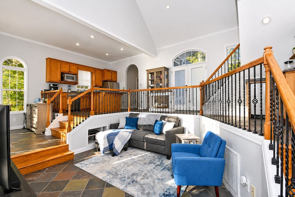 Gather in the living room for cozy evenings overlooking the lake.