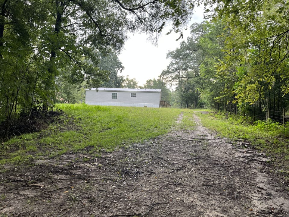 standing on Private boat ramp looking at back of home- 