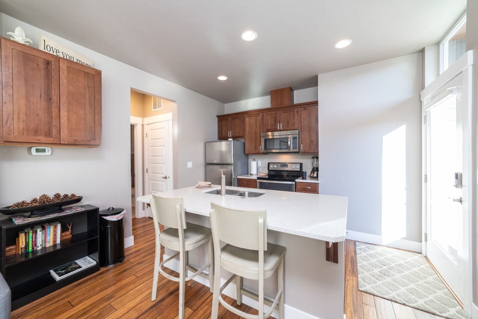 Well stocked pantry and kitchen. Lots of light and space. Quartz countertops.