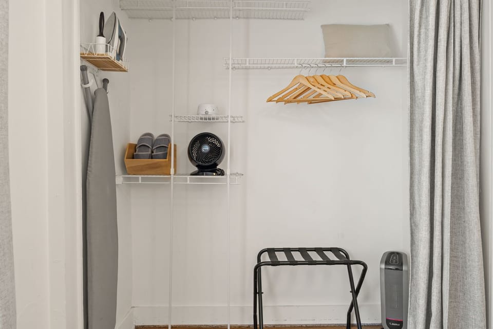 Sound machine, extra fan, house slippers, wood hangers, luggage rack , heater, floor fan, iron, ironing board.