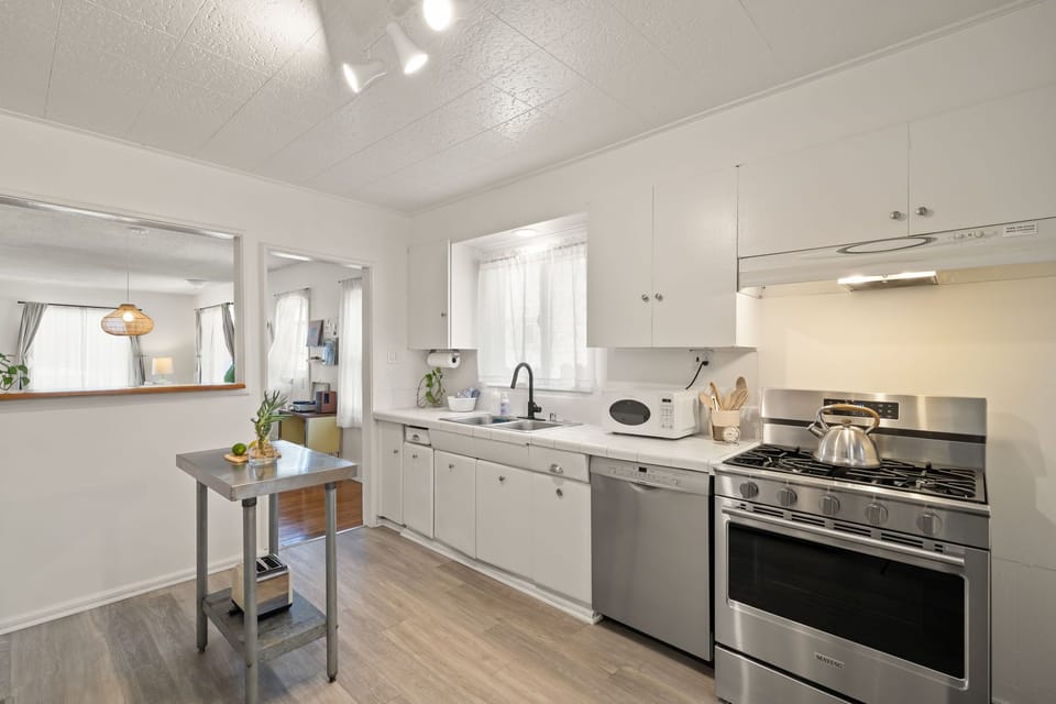 Brand new appliances. Create a beautiful meal in our spacious kitchen with stainless steel appliances. Fully equipped kitchen featuring a toaster oven, slice toaster, stove, oven and dishwasher. Opens up to the private backyard.
