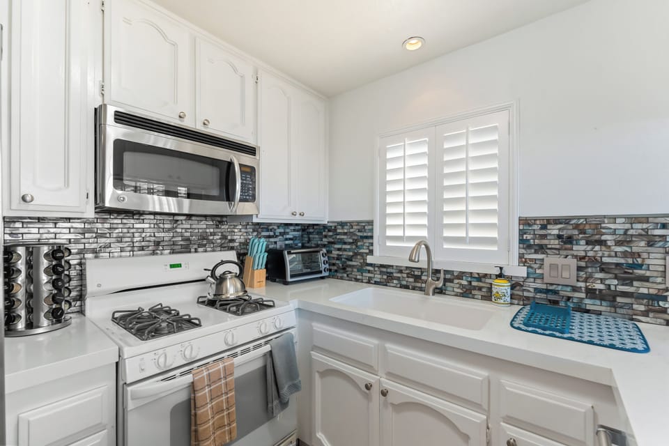 Spacious, fully stocked kitchen with everything you need—cookware, condiments, and a coffee station included!