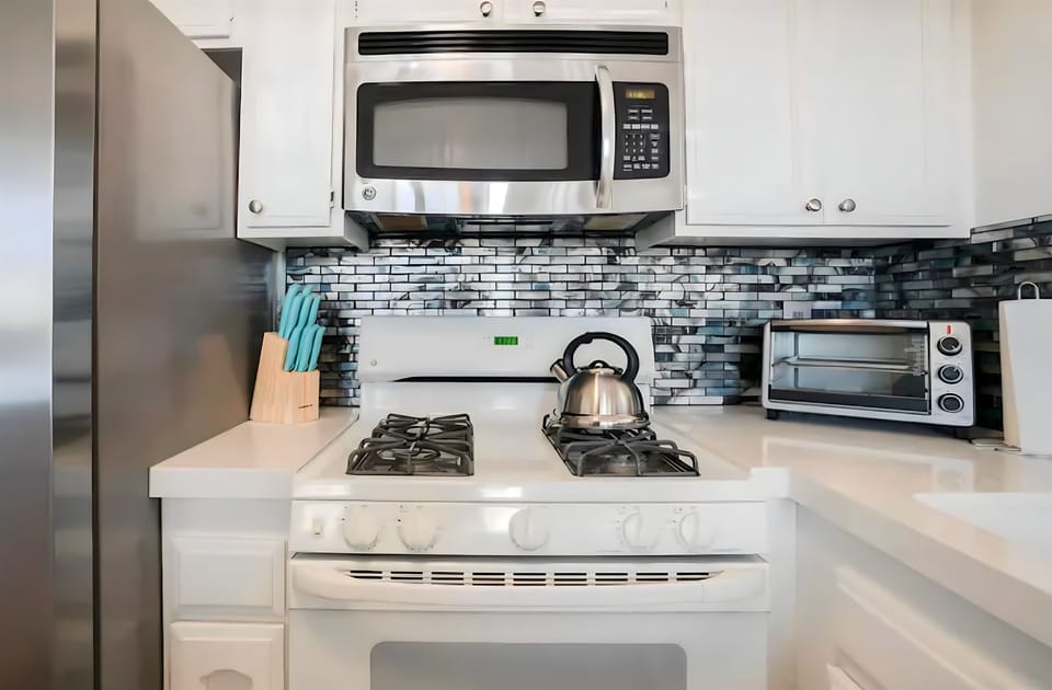 Spacious, fully stocked kitchen with everything you need—cookware, condiments, and a coffee station included!