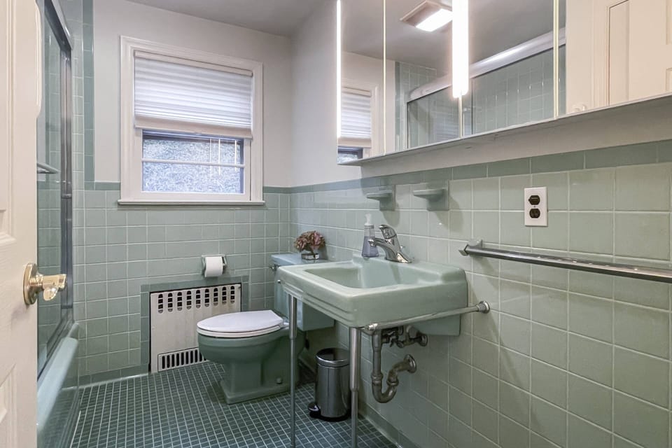 Step into vintage charm in the guest bathroom, merging nostalgia with modern comfort.