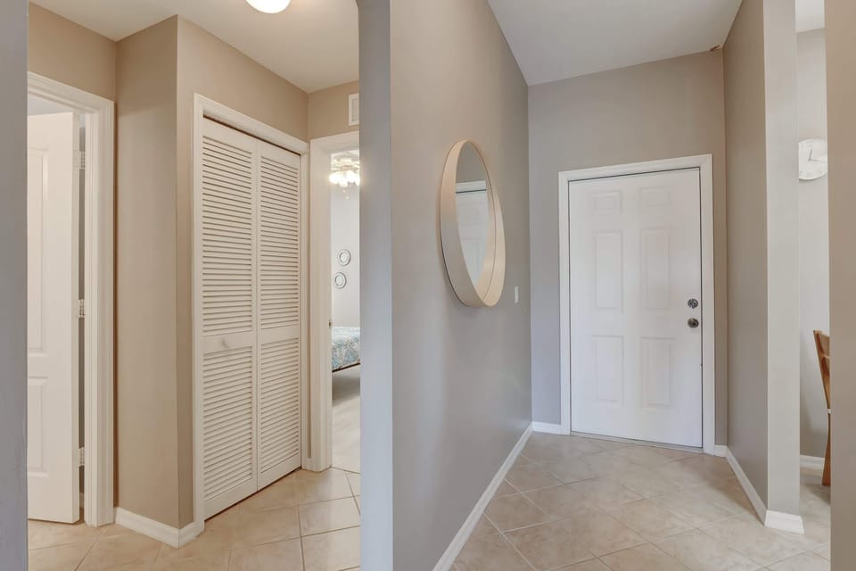 Coming Down a Little From the Front Door, the Second Bathroom is Behind the Second Open Door on the Left and the Second Bedroom is the Open Door in the Middle