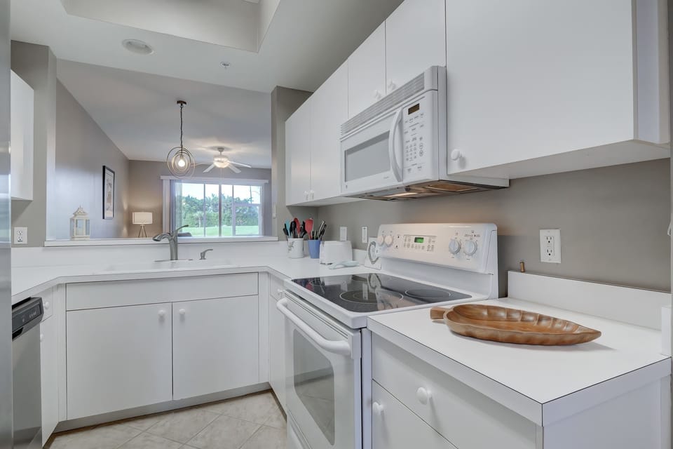The Kitchen Has A Large Open Pass Thru to the Formal Dining Area